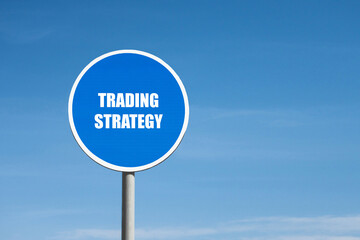 'Trading strategy' sign in blue round frame on sky background