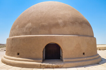 Dome over an antique Buddhist stupa (it's partially visible in the doorway). Excavation of the monastery on the Fayaz-Tepe hill in Termez, Uzbekistan