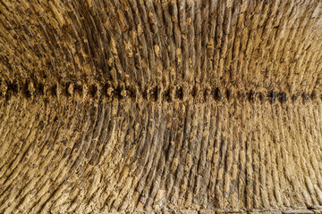 Rows of mud bricks in the building of a medieval building. Palace or caravanserai Kyr Kyz Kala,...