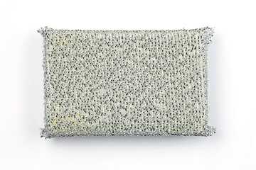 silver kitchen sponge with lurex on a white background top view. Hard sponge for washing dishes....