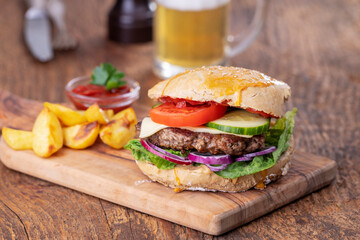 home made burger on dark wood