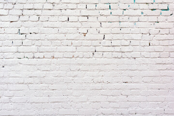 white ruined industrial brick wall