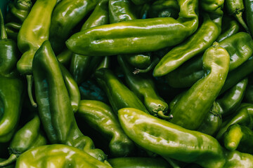 Fresh green peppers on vegetable market. 