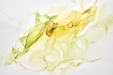 Abstract ocher green watercolor background. Yellow orange brown paint stains and spots in water,...