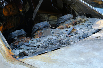 Fototapeta premium Melted head restraints and rear window of burned out car.