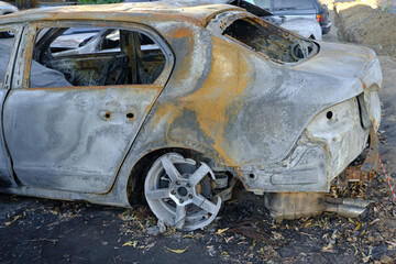 Skeleton of burnt out car.Trunk of a burnt out car.
