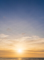 Naklejka na ściany i meble sunset sky vertical over the sea