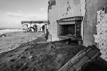 Fototapeta na wymiar Fireplace from destroyed house on the beach in Naples Italy