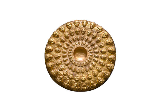 Replica of gold Phiale (libation bowl) embossed with 72 heads isolated on white background. Part of the Panagyurishte Treasure in Bulgaria. Thracian civilization, IV-III century BC