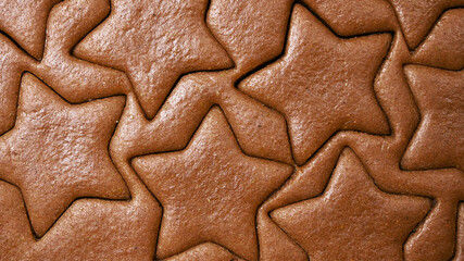 Baking process .Gingerbread dough for christmas cookies texture with star shapes
