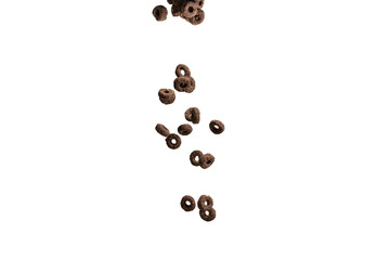 Chocolate rings cereal spill out into a bowl. Breakfast.