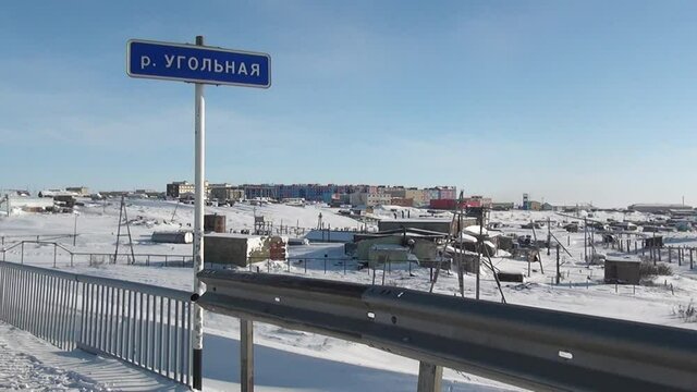 Chukotka, Russia. - 13 April 2013: Car on snow road in Anadyr city on far north. Cold snow town on edge of earth.