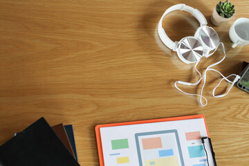 Obraz na płótnie Canvas white headphones on desk with business analysis chart