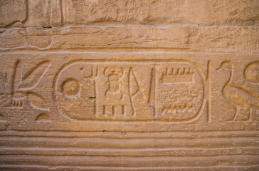 Anscient Temple of Karnak in Luxor - Ruined Thebes Egypt. Wall with hieroglyphs in the ancient...