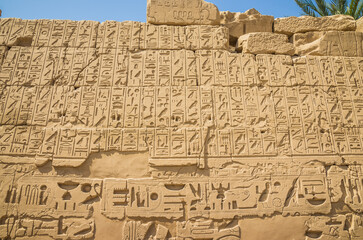 Anscient Temple of Karnak in Luxor - Ruined Thebes Egypt. Wall with hieroglyphs in the ancient...
