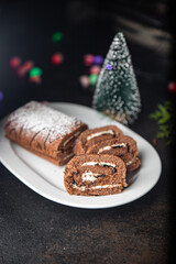 Fototapeta na wymiar christmas cake roll chocolate white cream ready to eat meal snack on the table copy space food background rustic. top view