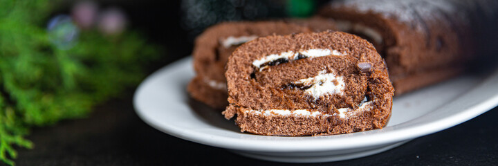 christmas cake roll chocolate white cream ready to eat meal snack on the table copy space food background rustic. top view