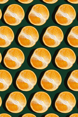 Pattern from a cut orange on a green background.