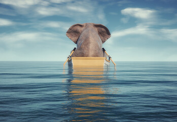 Fototapeta premium Elephant on a boat in the ocean.