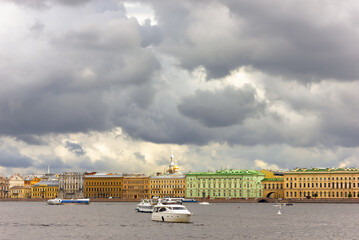 Yacht, and passenger ships, motor boats, sailing along the waterfront in St. Petersburg. Photo.