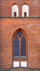 General view and architectural details in a close-up of the Neo-Gothic Catholic Church of Our Lady of the Angels erected in 1921 in the village of Czarna Wieś Kościelna in Podlasie, Poland.