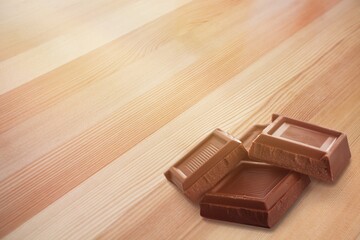 Sweet tasty chocolate bar on the desk