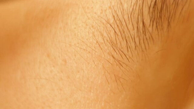 Close up plucking eyebrows video. Face hair removal with tweezers. Beauty salon procedure 