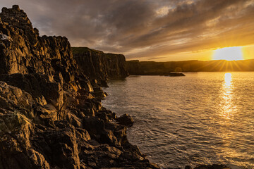 Sunset on the North Coast of Ireland during summer, Causeway Coast and Glens coastal route, County...