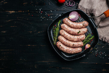 Raw stuffed sausages on srill pan, Sausages in cookware. Sausages for grilling. banner, menu,...