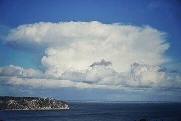 Fototapeta na wymiar Ballard Point, Swanage, Dorset, chalk cliff with clouds above sea