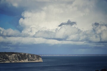 Fototapeta na wymiar Ballard Point, Swanage, Dorset, chalk cliff with clouds above sea