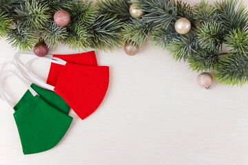 Handmade face mask in red and green colors. Christmas concept.