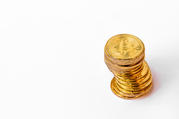 A pile of Bitcoins that have a gold color that is currently popular and has an increasing value compared to the US Dollar. For payment, finance, investment and economy concepts