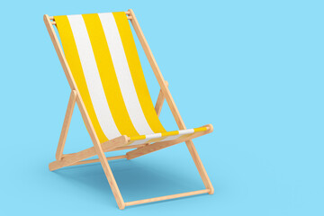 Yellow striped beach chair for summer getaways isolated on blue background.
