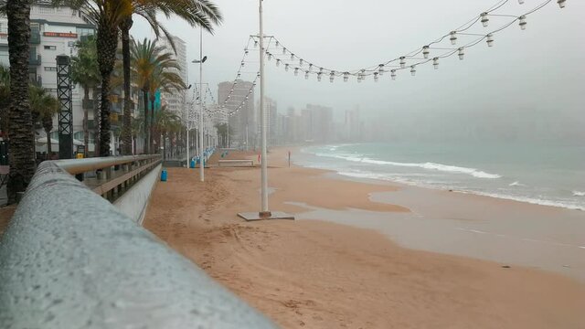 Levante beach in Benidorm a cloudy, rainy and misty day