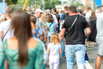 Crowd of people with men and women on busy city street