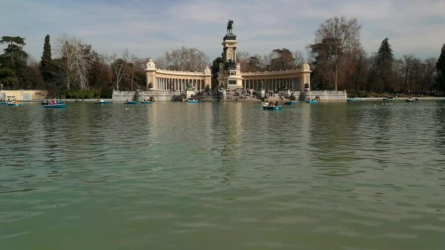 Lake of the Retiro Park ( Porque del Retiro )in Madrid with people paddling in boats  