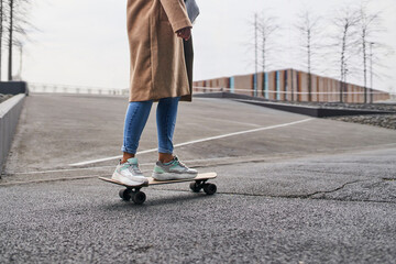 Picture of unrecognisable woman skating in the city