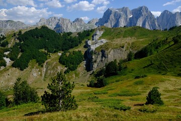 Fototapeta na wymiar Mountain views during trekking along the most beautiful tourist loop on the Montenegrin side of the Prokletije Mountains: Volusnica (1879 m) - Taljanka (2018 m) - Popadija (2057 m). Montenegro