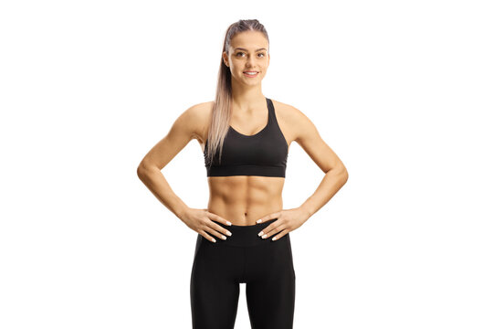 Yоung female in crop top and leggings smiling