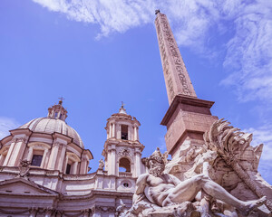 Fototapeta na wymiar the famous four rivers fountain with the Egyptian obelisk and baroque church in piazza Navona, Rome Italy