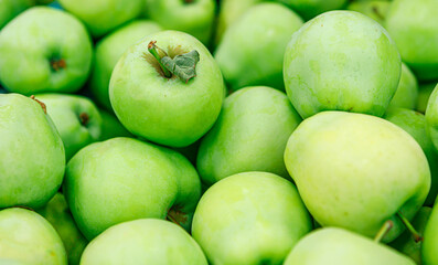 Fresh ripe green apples at the street market.