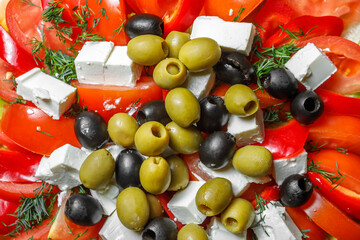 A mix of chopped tomatoes, cheese, olives and herbs.