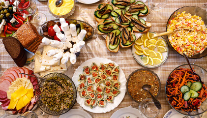 The dining table is filled with a variety of dishes.