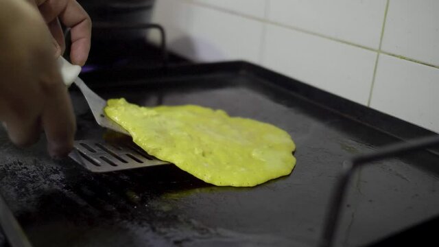 Preparation of a Traditional Venezuelan Dish, Sweet Corn Crepe Cachapa Filled with Cheese
