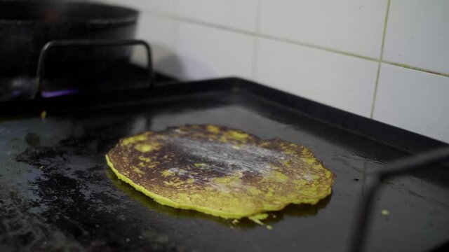 Preparation of a Traditional Venezuelan Dish, Sweet Corn Crepe Cachapa Filled with Cheese