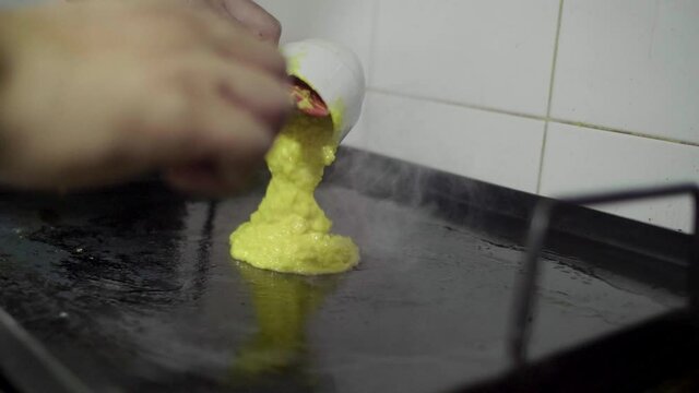 Preparation of a Traditional Venezuelan Dish, Sweet Corn Crepe Cachapa Filled with Cheese