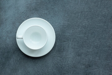 Top view of empty coffee cup on textured gray table