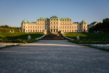 Fototapeta na wymiar Famous Belvedere castle (Schloss Belvedere) surrounded by gardens with classic statues, Vienna, Austria