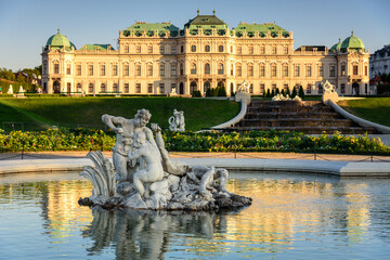 Famous Belvedere castle (Schloss Belvedere) surrounded by gardens with fountains and classic statues, Vienna, Austria